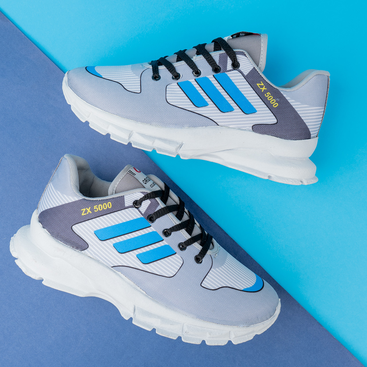 کفش ورزشی مردانه طوسی سه خط آبی مدل ZX5000