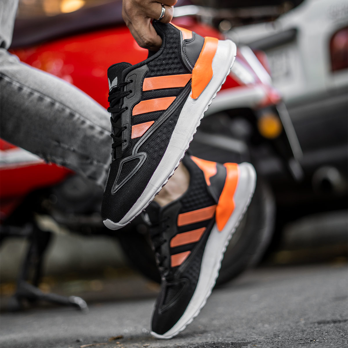کفش ورزشی Adidas مردانه مشکی نارنجی مدل Siban