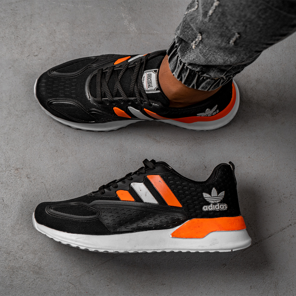 کفش ورزشی Adidas مردانه مشکی نارنجی مدل Tilda
